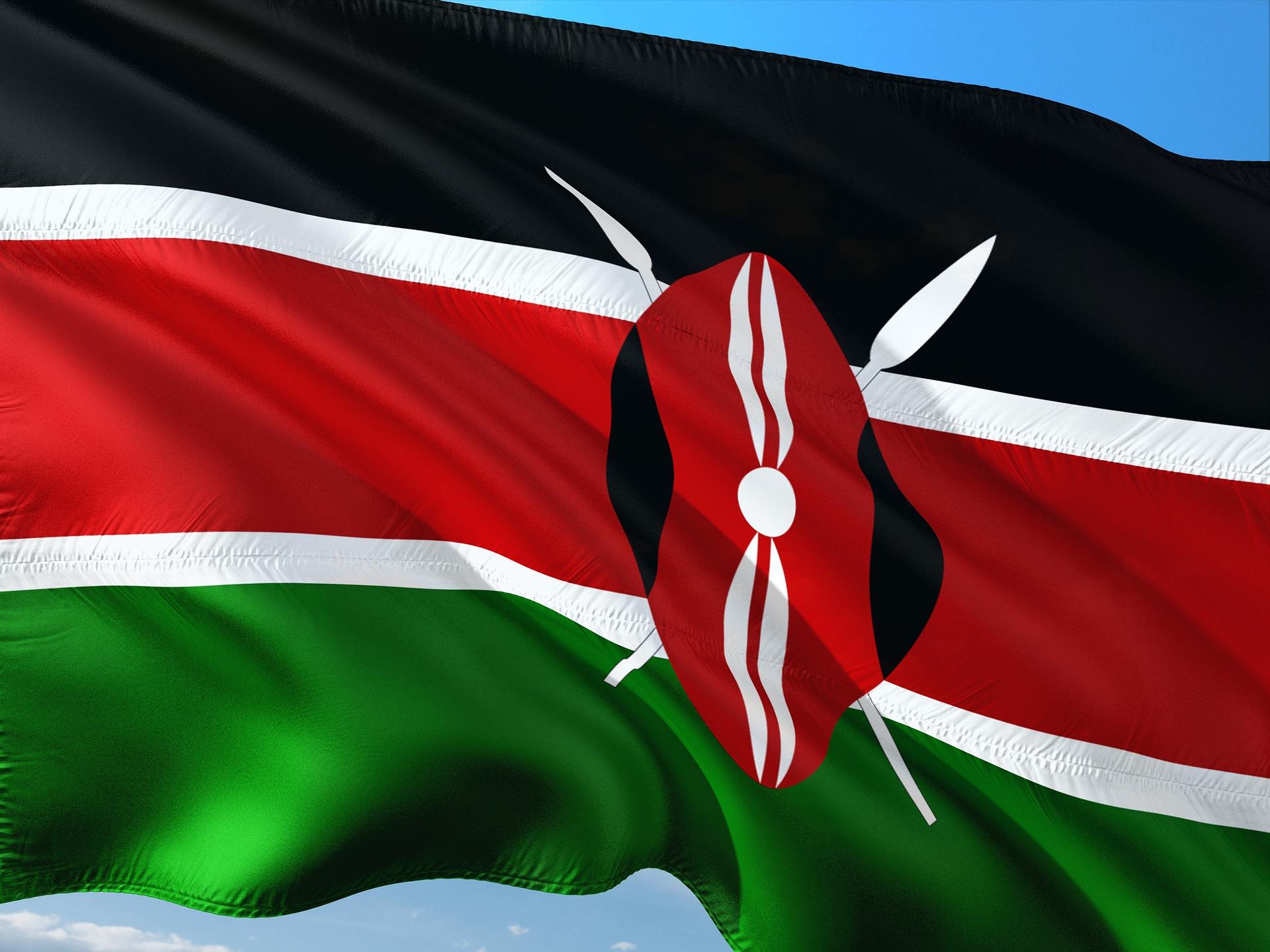 Flag of Kenya, blowing in the wind against a clear blue sky