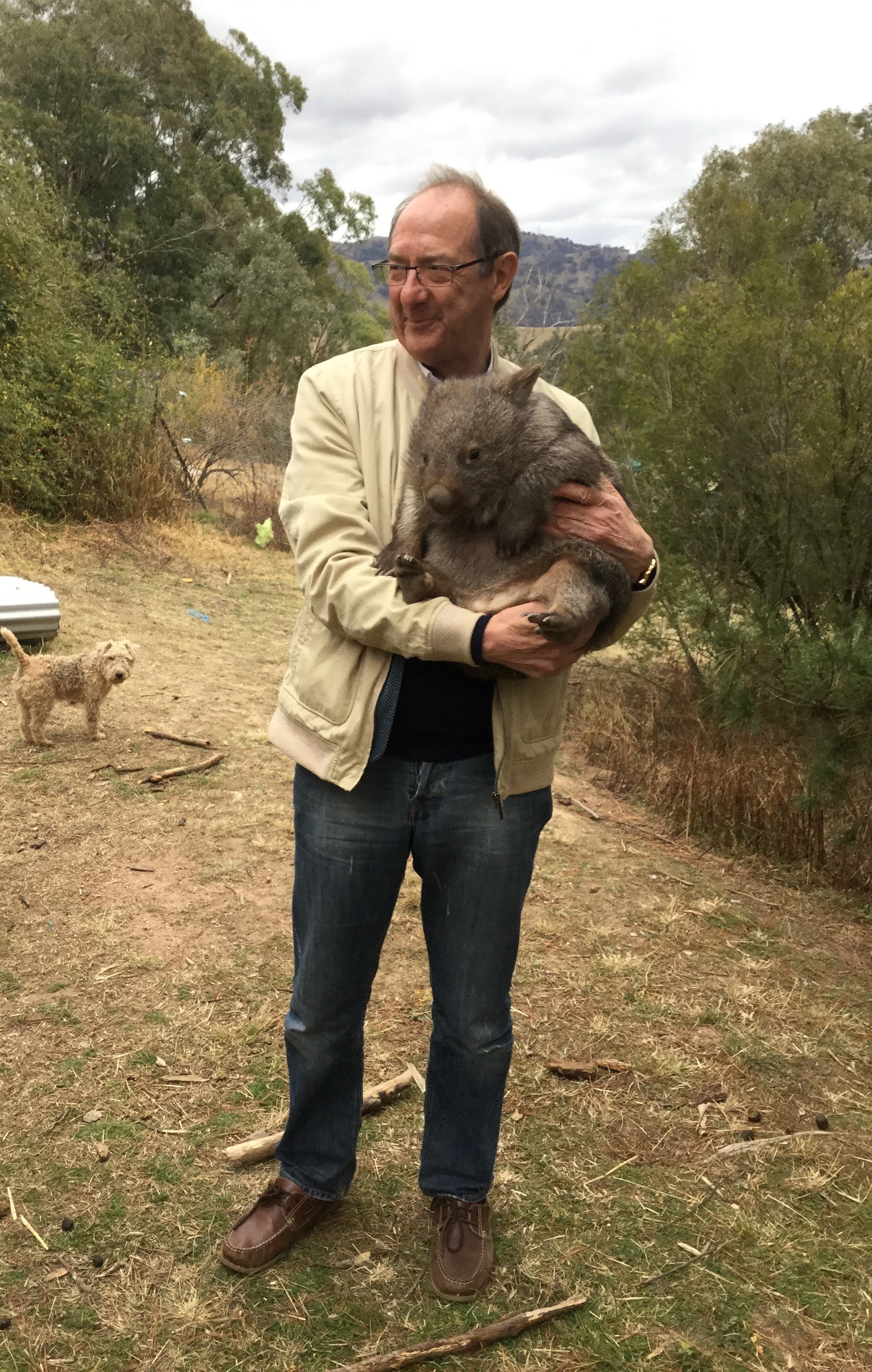 Bill Swaddling with a wombat