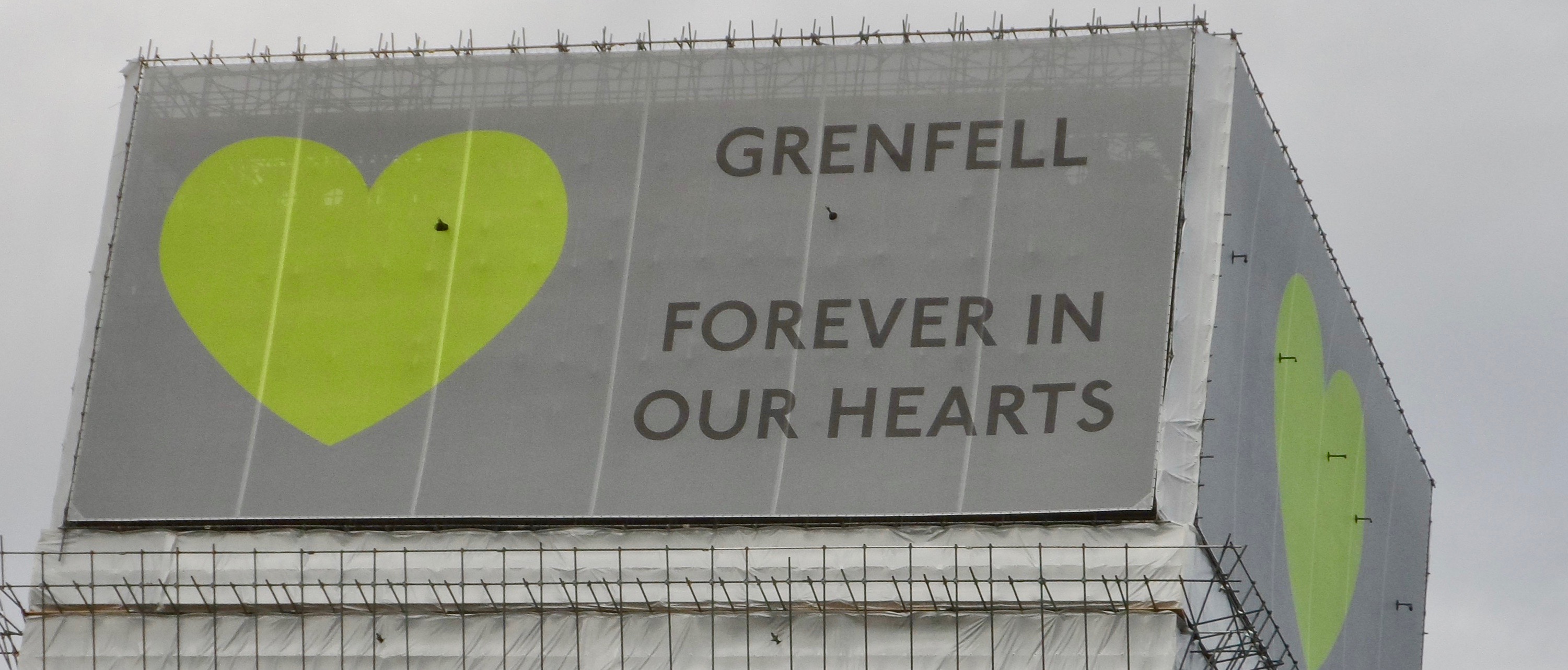 Top of Grenfell Tower with Banner