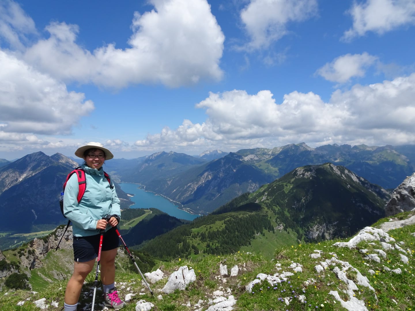 women at top of a mountain looking at scenery