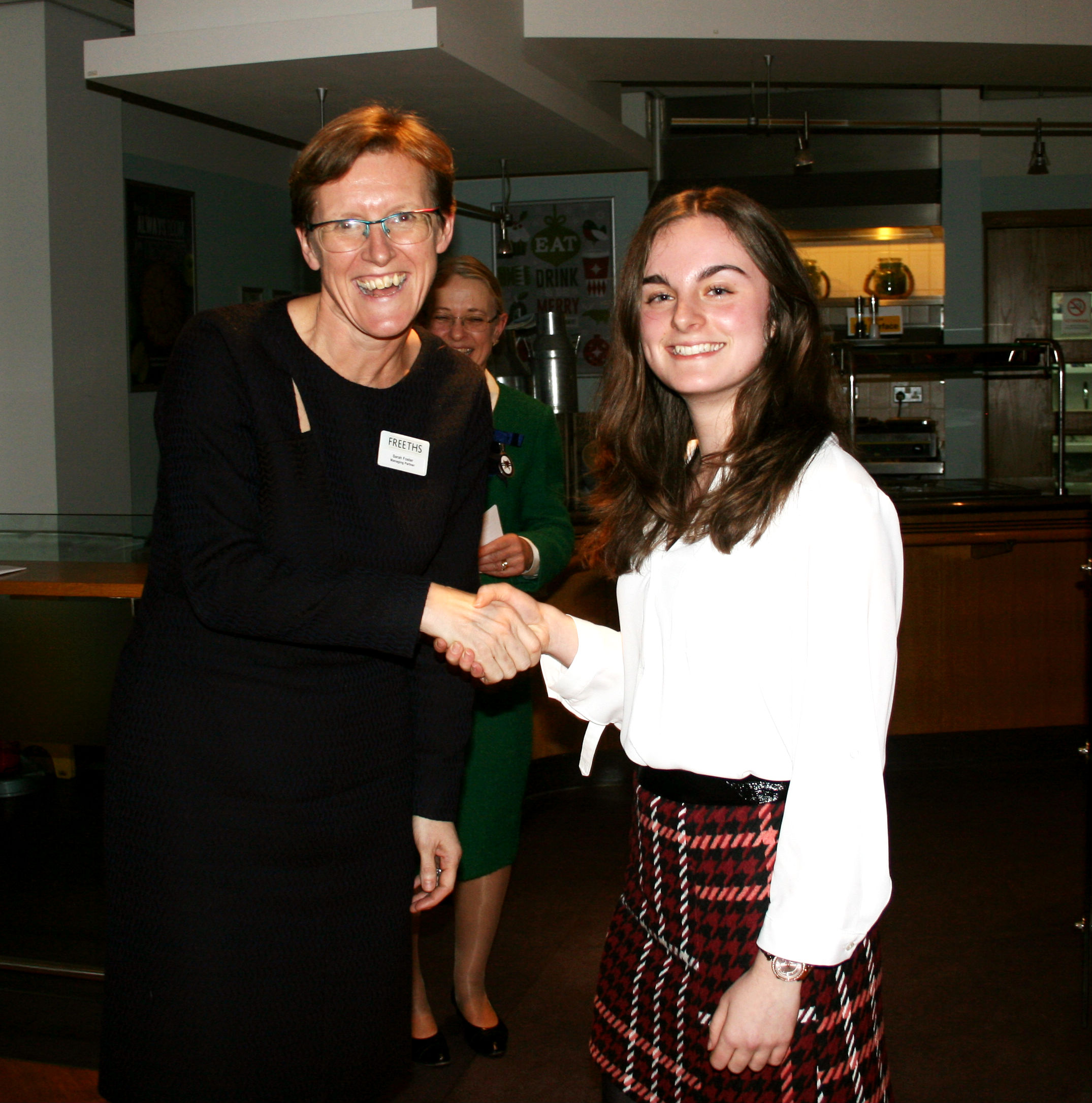 Ciara recieves her prize at a ceremony at Freeths Solicitors, Oxford.