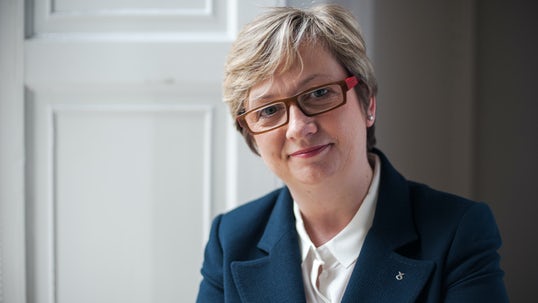 A photo of Joanna Cherry MP in a blue jacket, smiling.