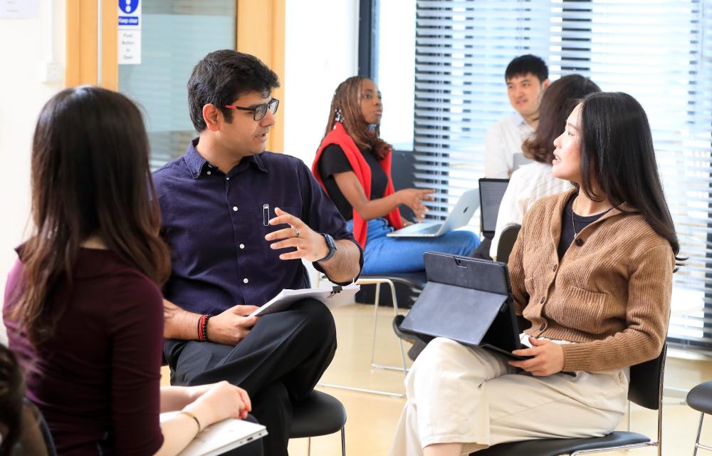 Image of several students in discussion 