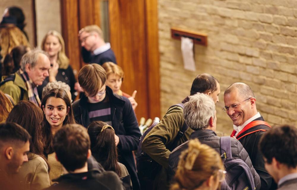 A group of people at an event in the faculty lecture theatre