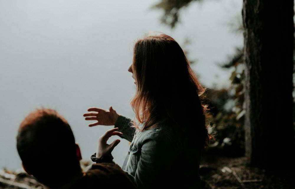 Woman gesticulating in conversation