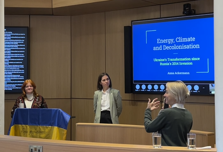 Three speakers in a lecture theatre