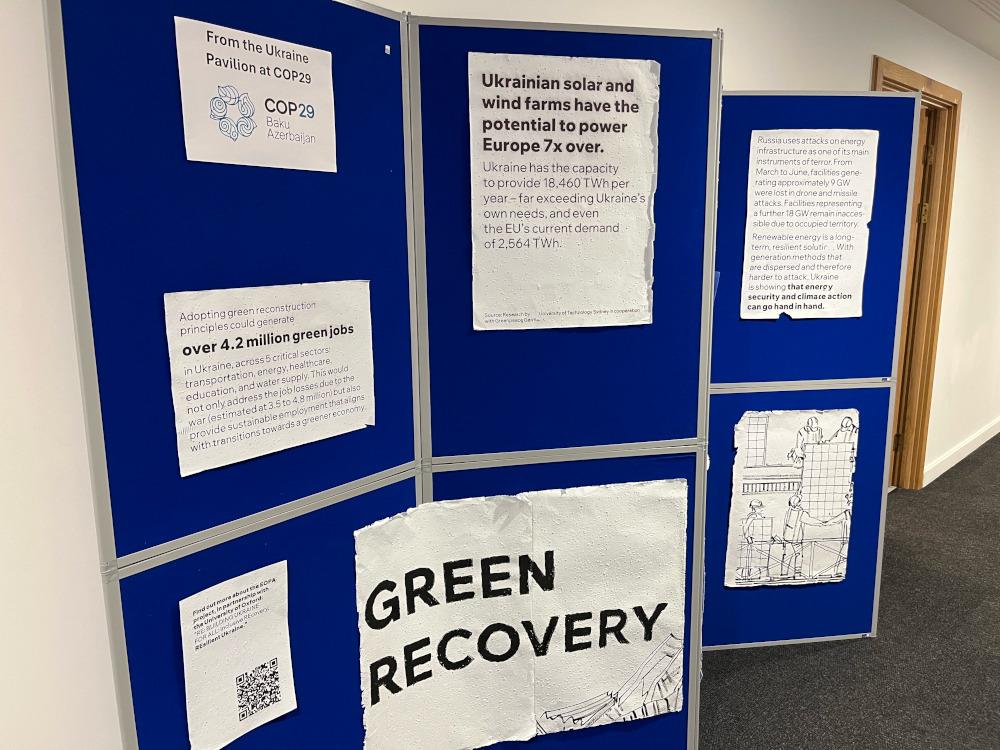 display of images and text on panels about green recovery