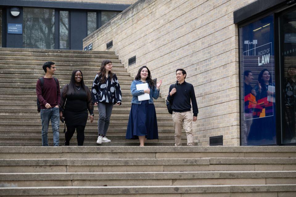 Students walking down St Cross Building steps