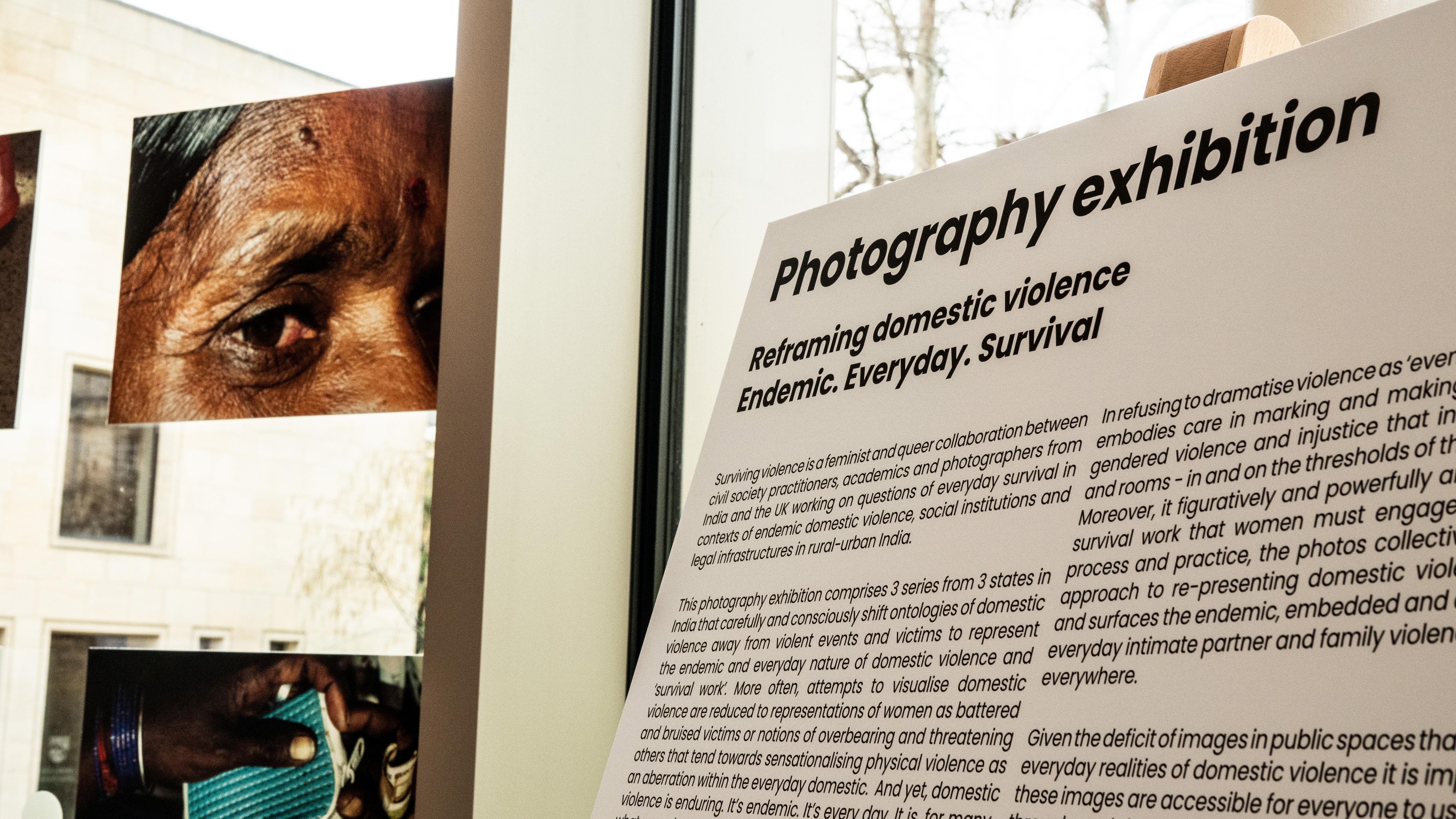 A display board with text on it describing the Photography exhibiton