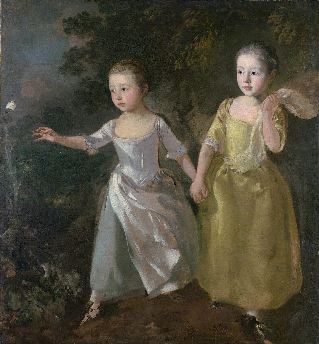 Two children holding hands in a garden, one reaching for a butterfly