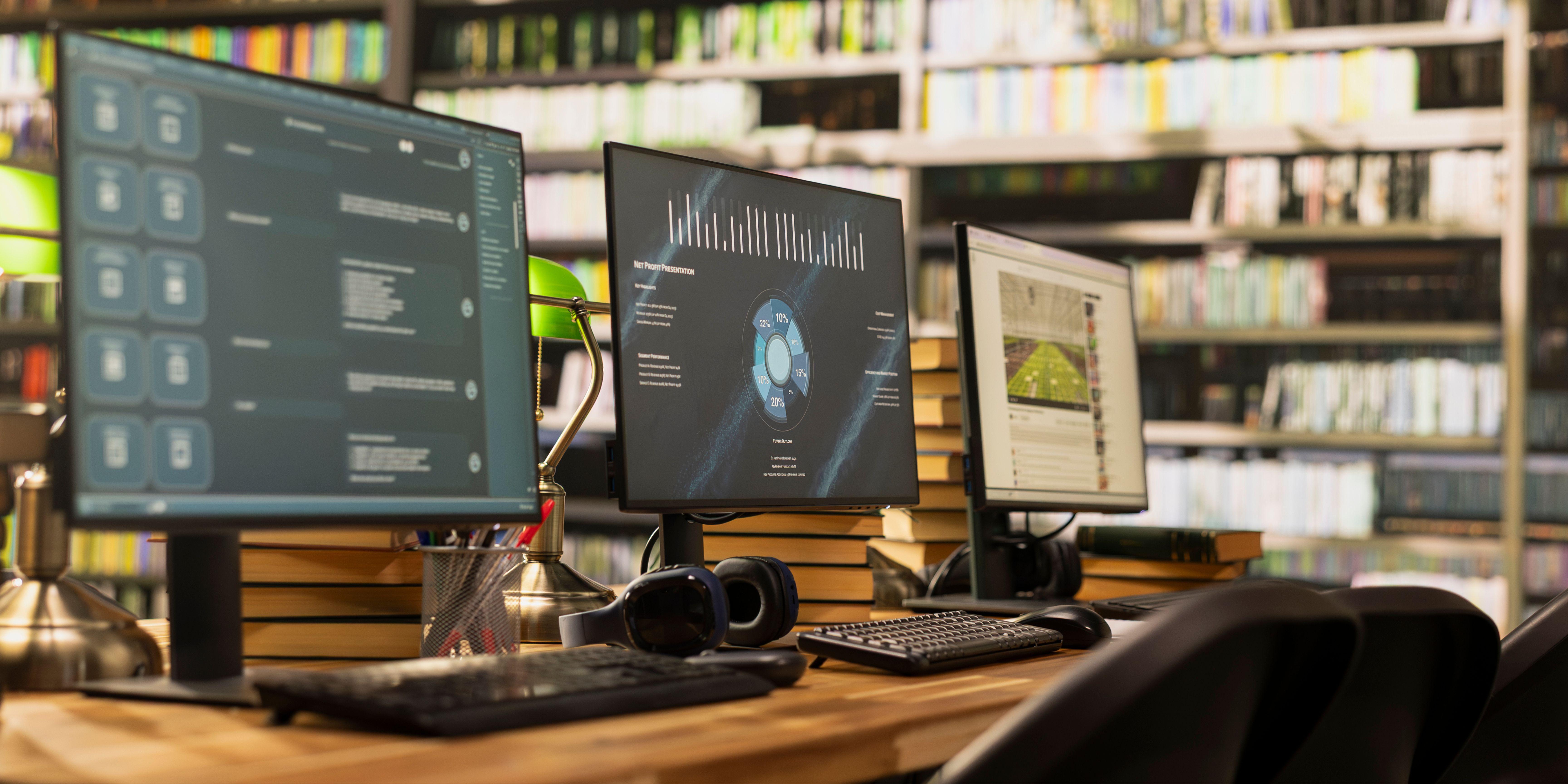 3 computer screens displaying AI workflows inside a library