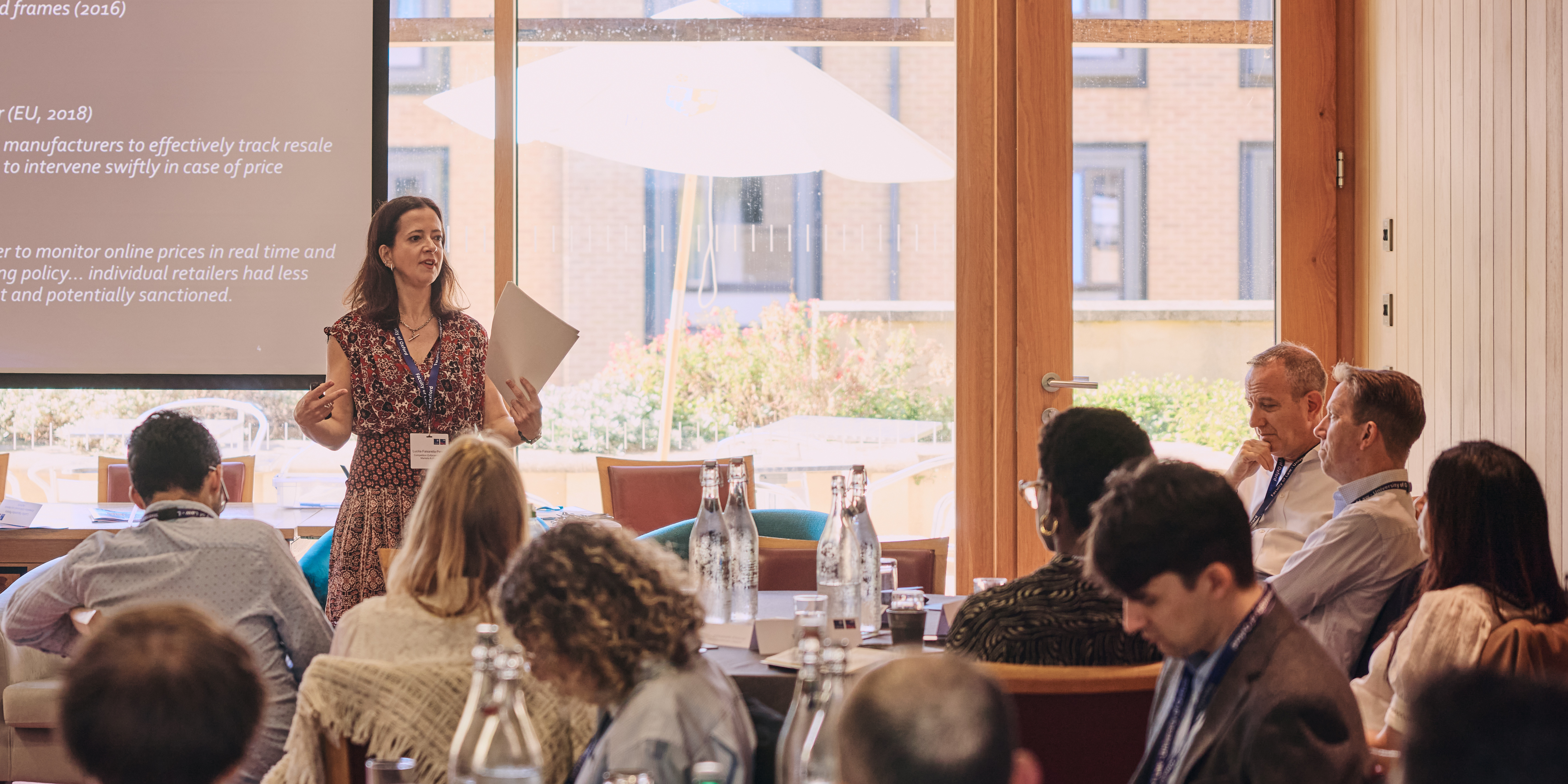 Female industry expert delivering a talk at a professional development programme at the University of Oxford