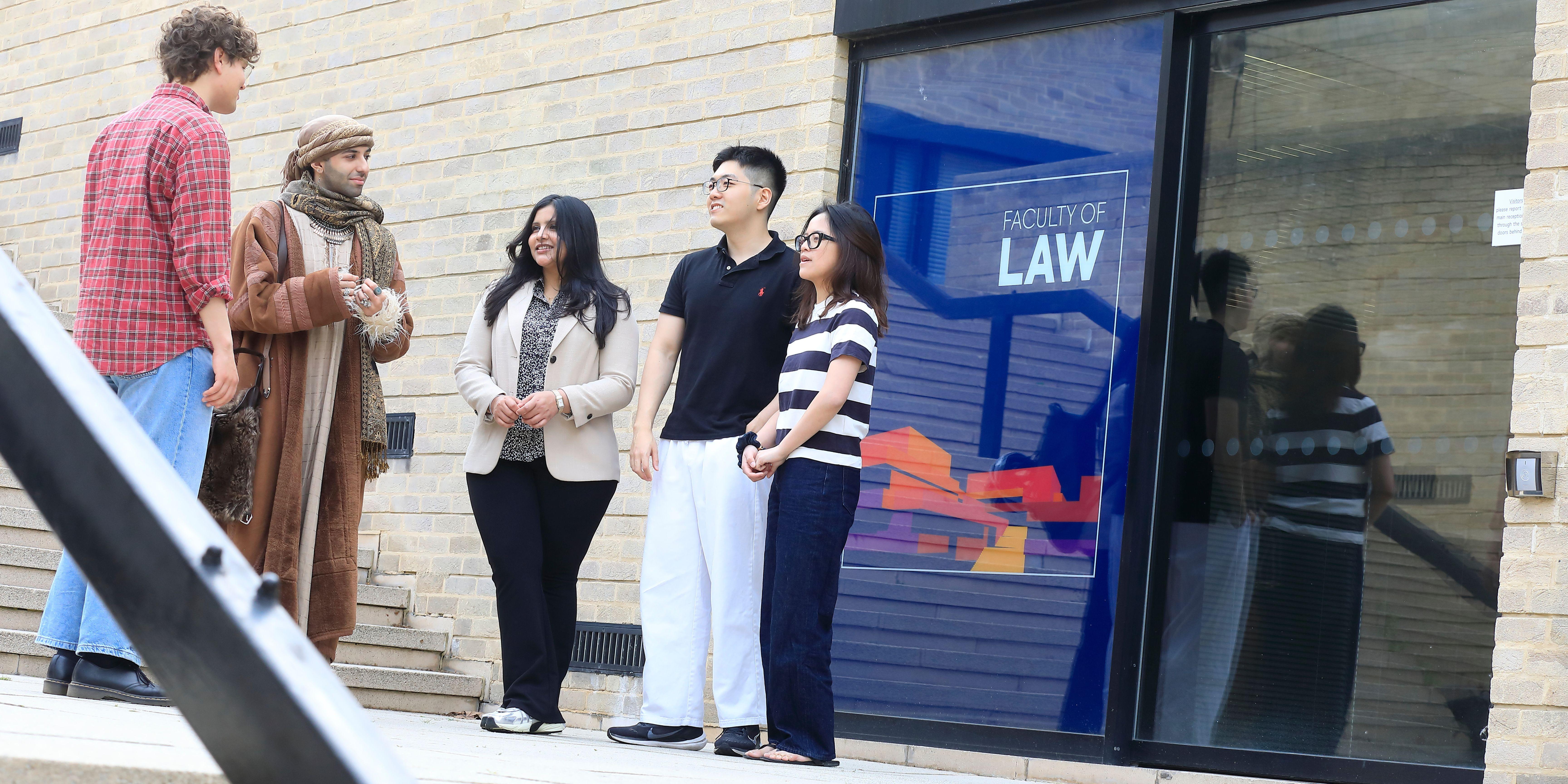 Students chatting outside the Faculty of Law at the University of Oxford