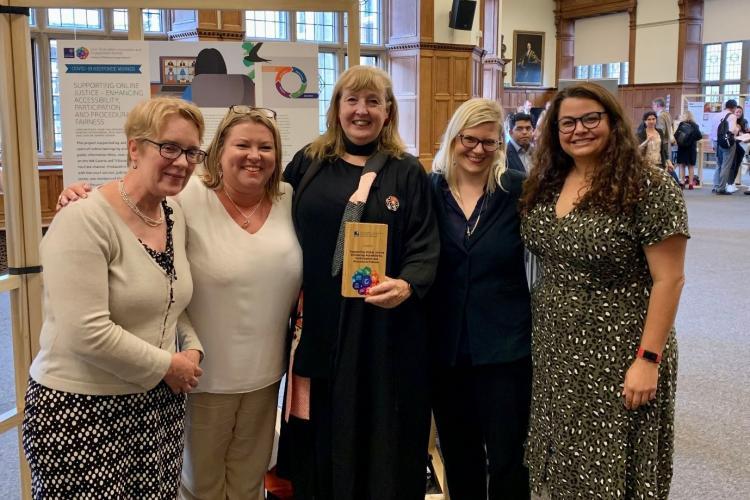 CSLS team holding award