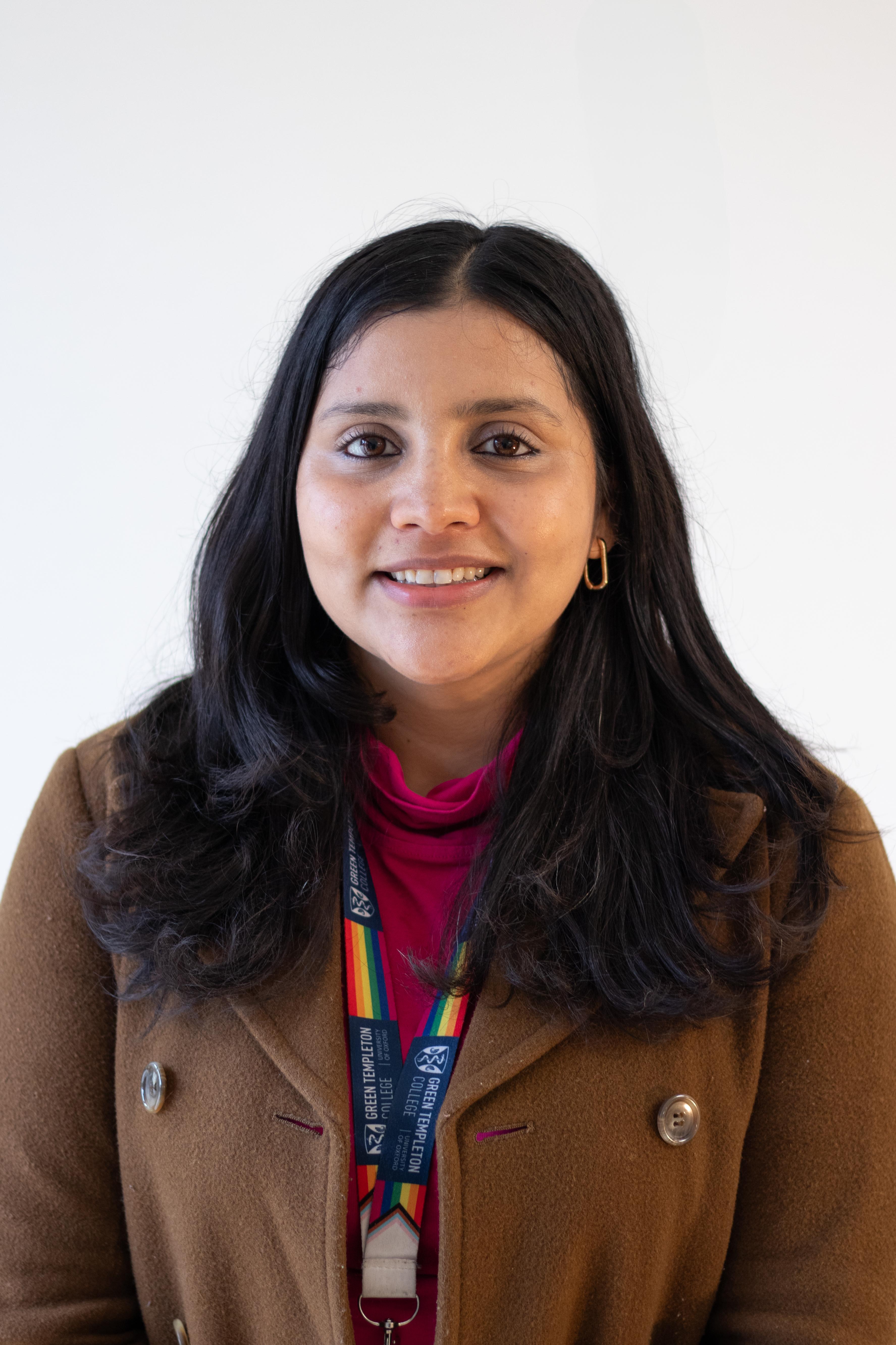 Headshot of Ayushi looking into the camera 