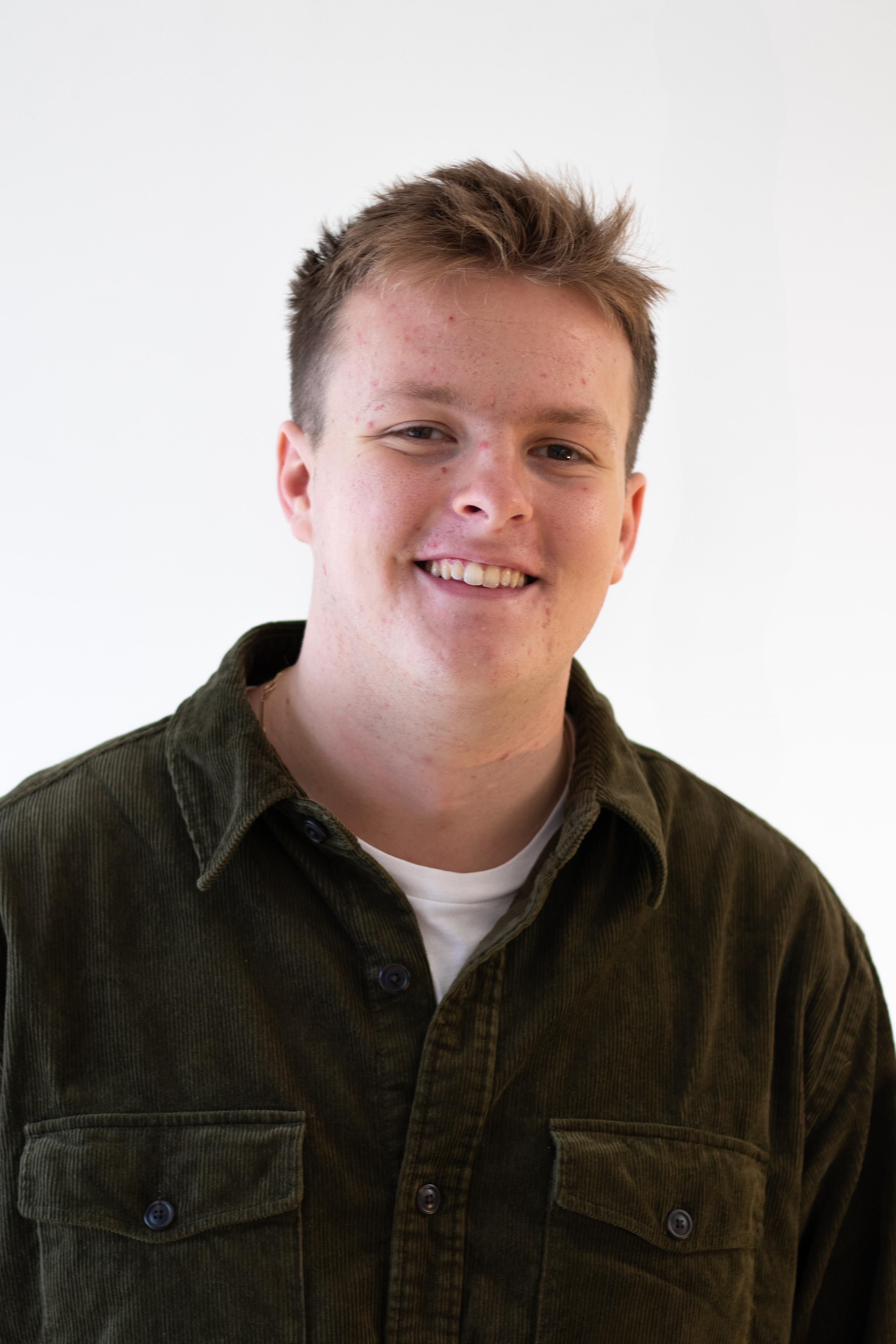 Headshot of Peter facing front to the camera 
