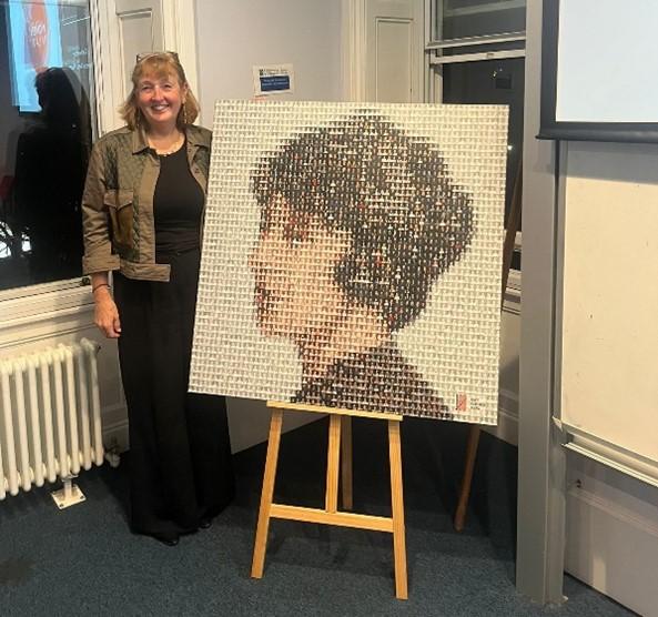 The photograph above shows Linda with an image of Madge made up of a collection of photographs of female lawyers in Scotland