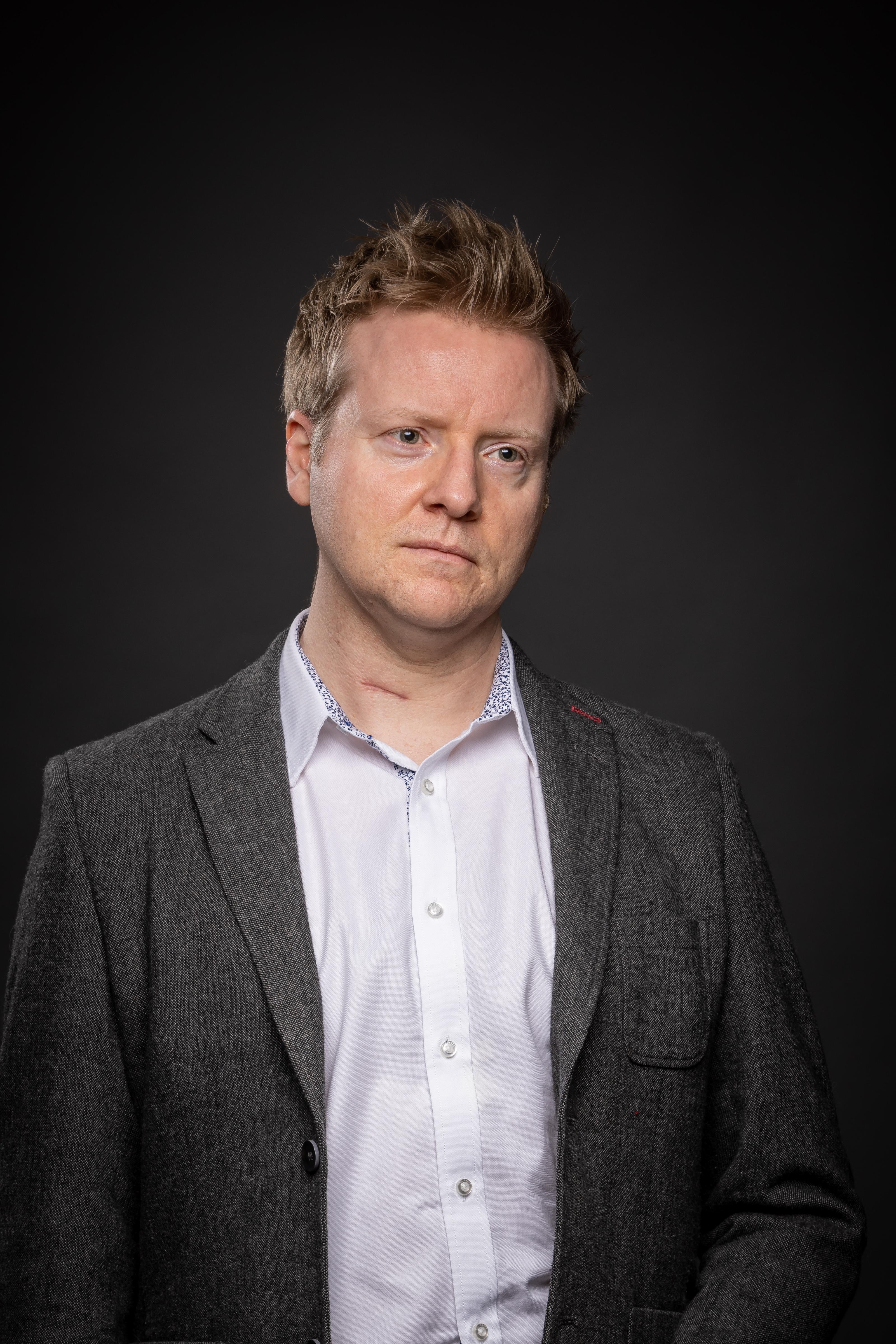 Paul Wragg wearing a white formal shirt and a dark blazer