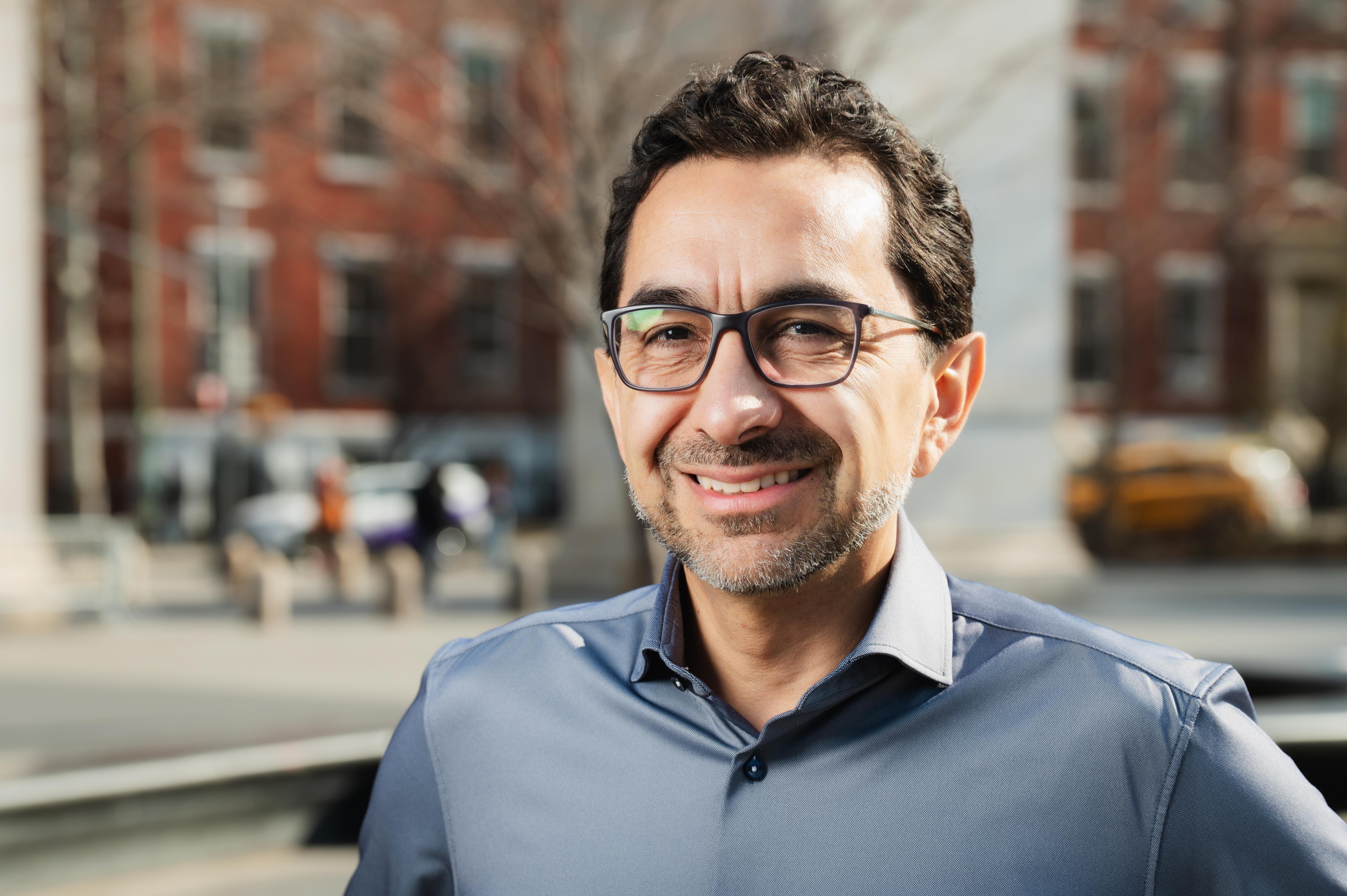 Cesar in a grey formal shirt