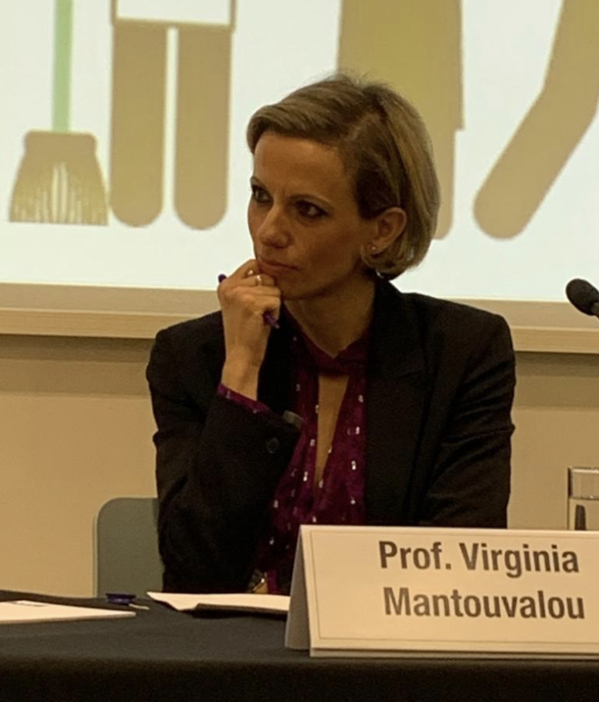 Candid of Virginia Mantouvalou at a conference.