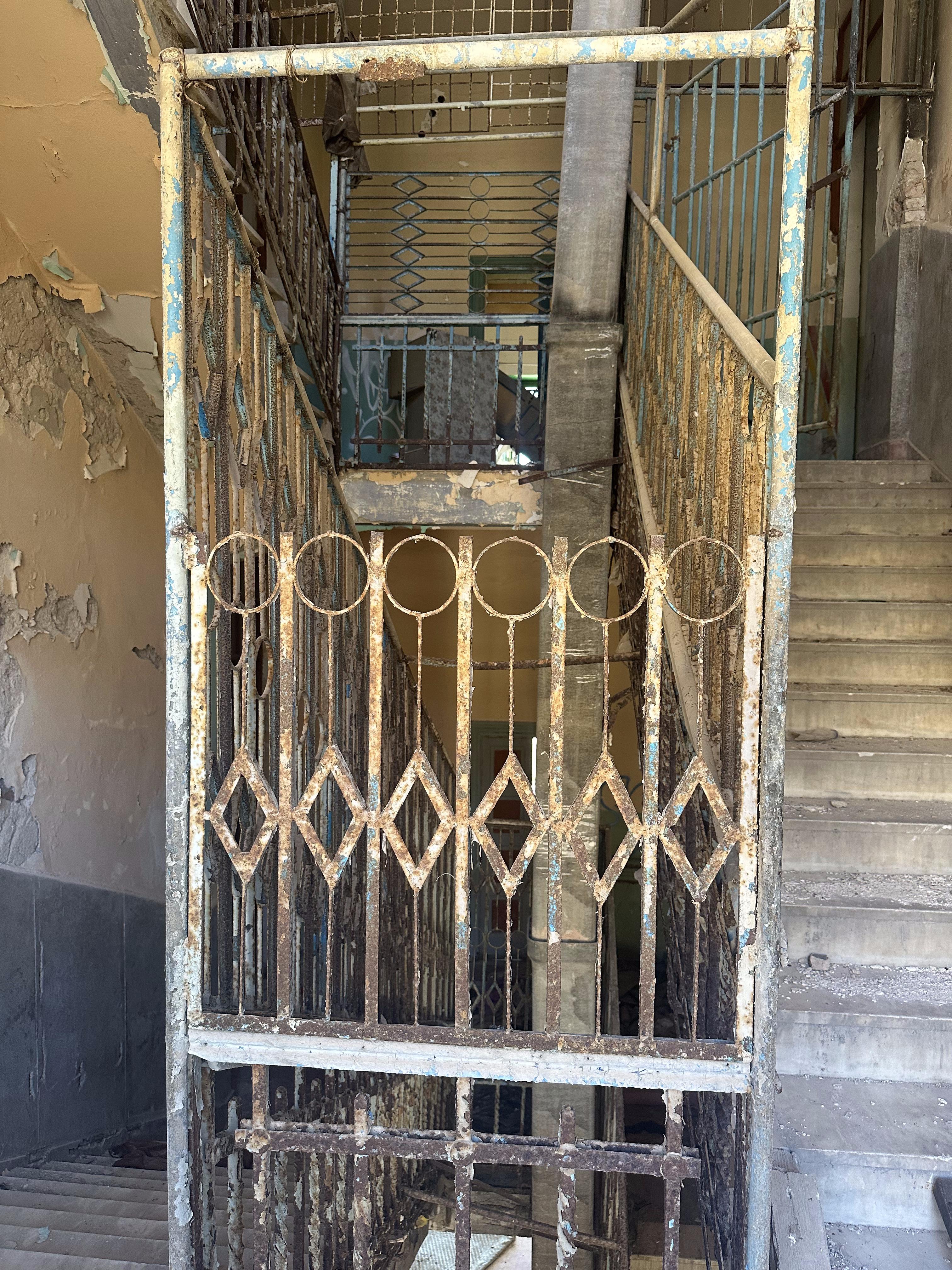 A rusty door in an abandoned building