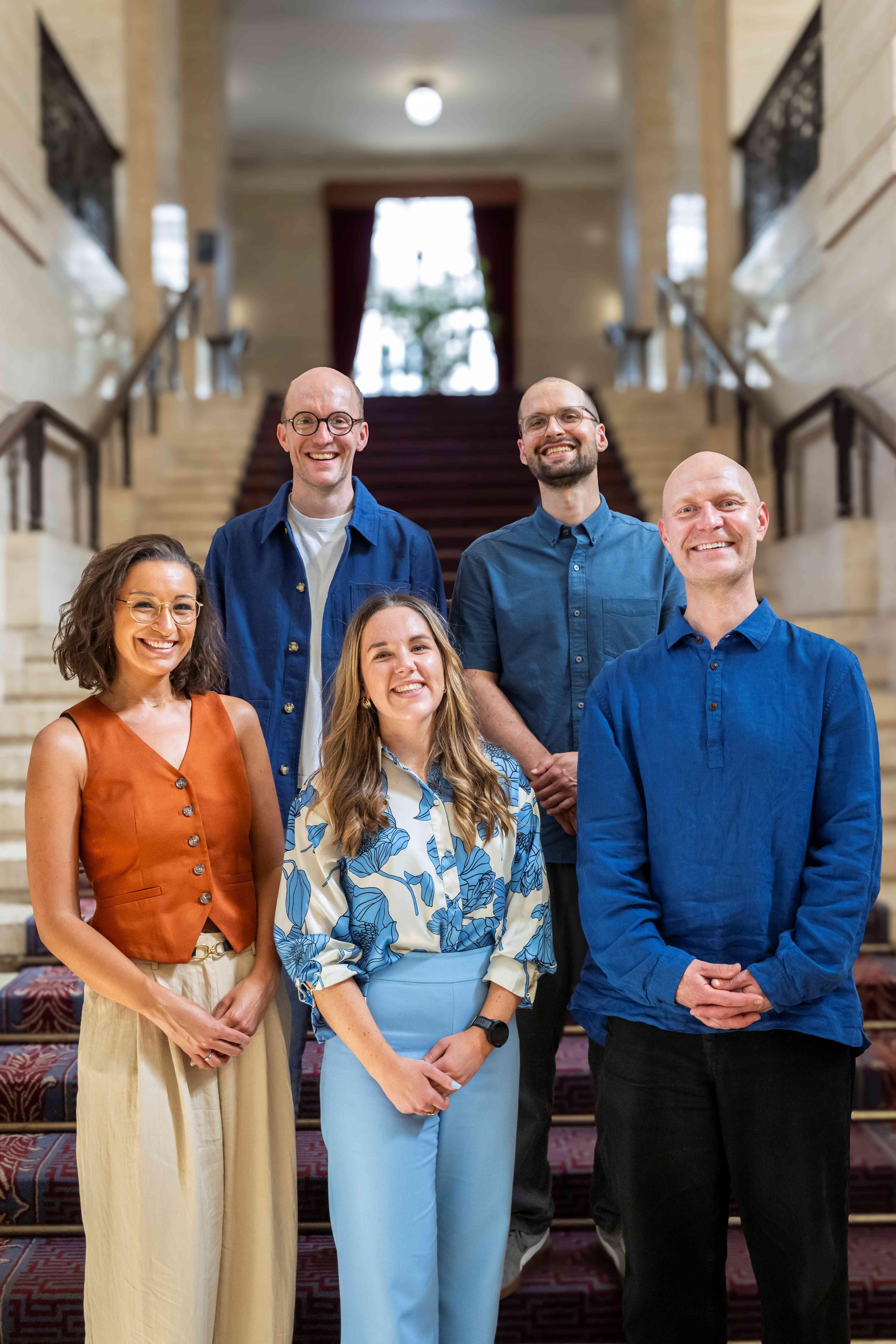 Group photo of the New Generation Thinkers 2026 - (Front row) Dr Genevieve Robyn Arkle, Frances Hand, and Dr Siôn Parkinson. (Back row) Joe Shute and Dr Jakub Kowalewski