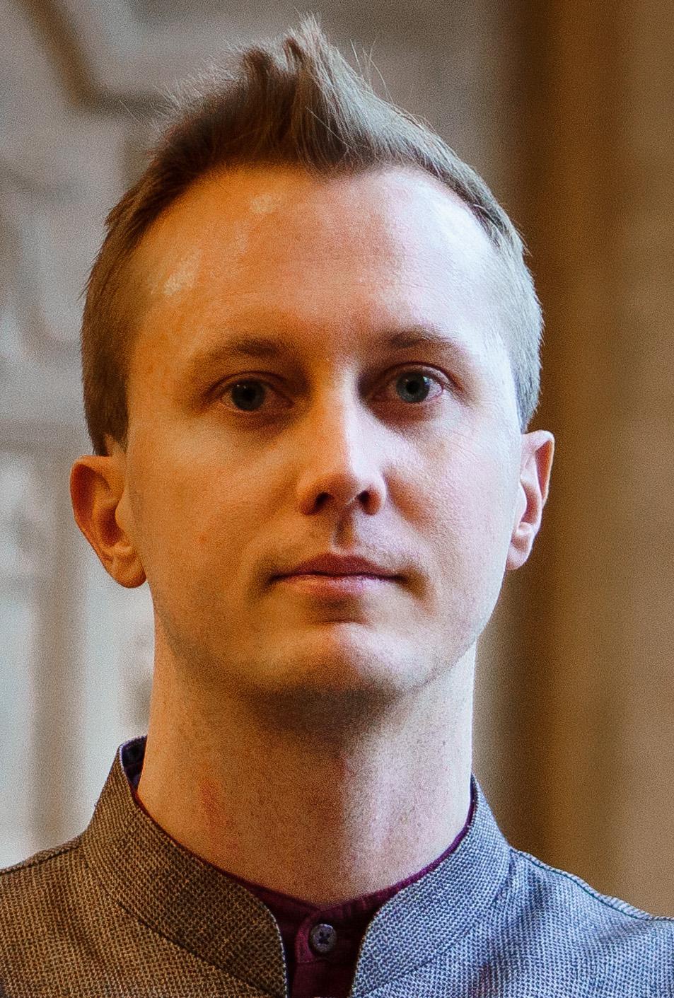 A white man with short blond hair